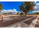 Bocce ball court with benches, well-maintained grounds, and the American flag in a welcoming community at 8248 E Emelita Ave, Mesa, AZ 85208