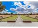 Well-maintained bocce ball court with green turf and benches, providing a relaxing recreational space at 8248 E Emelita Ave, Mesa, AZ 85208