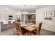 Dining room with open layout to the kitchen and living areas at 8248 E Emelita Ave, Mesa, AZ 85208