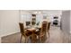 Dining room with a wooden table and chairs open to the kitchen at 8248 E Emelita Ave, Mesa, AZ 85208