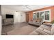 Comfortable living room with hardwood floors and a plush sofa at 8248 E Emelita Ave, Mesa, AZ 85208