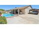 Backyard features covered patio, pool, and carport at 10138 W Oregon Ave, Glendale, AZ 85307
