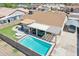 Inviting backyard features a sparkling pool, covered patio, and outdoor kitchen for entertaining at 10138 W Oregon Ave, Glendale, AZ 85307