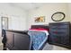 Bedroom with a bed, carpet, dresser and mirror at 10138 W Oregon Ave, Glendale, AZ 85307
