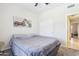 Bedroom with a bed, carpet and a motorcycle picture hanging on the wall at 10138 W Oregon Ave, Glendale, AZ 85307