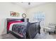 Bedroom with a bed, carpet, dresser, mirror, chair, and a window with blinds at 10138 W Oregon Ave, Glendale, AZ 85307