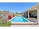 A private swimming pool surrounded by a patio, covered seating area and landscaped backyard at 10138 W Oregon Ave, Glendale, AZ 85307