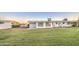 Large backyard with green lawn, perfect for outdoor activities and entertaining at 10620 W Clair Dr, Sun City, AZ 85351