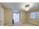 Comfortable bedroom with neutral carpeting, ceiling fan, closet, and window for natural light at 10620 W Clair Dr, Sun City, AZ 85351