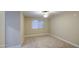 Cozy bedroom with neutral carpeting, a ceiling fan, and a window for natural light at 10620 W Clair Dr, Sun City, AZ 85351