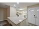 Spacious kitchen with a large island, stainless steel appliances, and ample counter space, ideal for entertaining at 10620 W Clair Dr, Sun City, AZ 85351