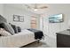 Cozy bedroom featuring neutral decor, a ceiling fan, and a mounted TV at 1070 S Amber St, Chandler, AZ 85286