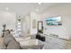 Inviting living room with a large sectional sofa, modern decor, high ceilings, and plenty of natural light at 1070 S Amber St, Chandler, AZ 85286