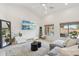 Bright living room featuring a large sectional, stylish decor, and windows that bring in natural light at 1070 S Amber St, Chandler, AZ 85286