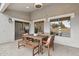Covered outdoor patio featuring brick pavers and wooden furniture, perfect for entertaining at 1070 S Amber St, Chandler, AZ 85286