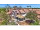 Aerial view of the house showing the backyard, covered patio, and desert landscaping at 1130 S Surfside Dr, Gilbert, AZ 85233