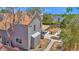 This aerial view shows the house, backyard, covered patio, and desert landscaping at 1130 S Surfside Dr, Gilbert, AZ 85233