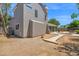 The backyard includes patio, desert landscaping, and access to the back of the home at 1130 S Surfside Dr, Gilbert, AZ 85233