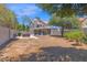 Wide view of backyard featuring desert landscaping, covered patio, privacy wall at 1130 S Surfside Dr, Gilbert, AZ 85233