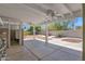 Spacious covered backyard with a built-in grill and an expansive space for outdoor living at 1130 S Surfside Dr, Gilbert, AZ 85233
