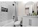 Charming bathroom with a tub and shower combo, a stylish vanity, and a shower curtain at 1130 S Surfside Dr, Gilbert, AZ 85233