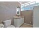 Outdoor bathroom featuring a vanity, a sink, a mirror, and a toilet at 1130 S Surfside Dr, Gilbert, AZ 85233
