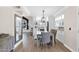 Open-concept dining room featuring modern lighting, stylish furniture, and seamless flow to other living spaces at 1130 S Surfside Dr, Gilbert, AZ 85233