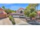 Charming two-story home with a well-maintained yard, attractive landscaping, and a spacious two-car garage at 1130 S Surfside Dr, Gilbert, AZ 85233