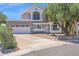 Inviting two-story home featuring a well-manicured front yard and a spacious two-car garage at 1130 S Surfside Dr, Gilbert, AZ 85233