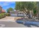 Charming two-story home with a well-maintained yard and a two-car garage on a sunny day at 1130 S Surfside Dr, Gilbert, AZ 85233