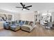 Spacious living room with a plush sectional sofa open to kitchen and dining areas at 1130 S Surfside Dr, Gilbert, AZ 85233