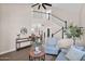 Spacious living room with staircase, sleek hardwood floors, neutral paint, and lots of natural light at 1130 S Surfside Dr, Gilbert, AZ 85233