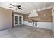 Covered outdoor kitchen with a built-in grill, countertops, a sink, and cabinet storage at 1130 S Surfside Dr, Gilbert, AZ 85233