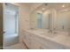 Stylish bathroom features dual sinks with stone countertops, a mirror, and luxury fixtures at 11300 N Casa Dega Dr # 1090, Surprise, AZ 85388