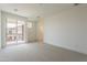 Spacious bedroom with a private balcony and an ensuite bathroom at 11300 N Casa Dega Dr # 1090, Surprise, AZ 85388