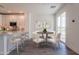 Cozy dining area with a modern table and chairs, complemented by a sliding glass door at 11300 N Casa Dega Dr # 1090, Surprise, AZ 85388