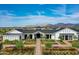 Beautiful building exterior with pristine landscaping, flowers, and a walking path entrance at 11300 N Casa Dega Dr # 1090, Surprise, AZ 85388