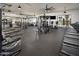 Community fitness center with weights and treadmills overlooking a greenbelt at 11300 N Casa Dega Dr # 1090, Surprise, AZ 85388