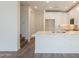 Modern kitchen with white cabinetry, quartz countertops, and wood-style flooring at 11300 N Casa Dega Dr # 1090, Surprise, AZ 85388