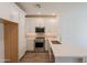 Bright kitchen with stainless steel appliances, light countertops, and modern finishes at 11300 N Casa Dega Dr # 1090, Surprise, AZ 85388