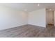 Contemporary living room with laminate wood flooring, offering a spacious and minimalist design at 11300 N Casa Dega Dr # 1090, Surprise, AZ 85388