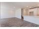 Open-concept living room boasts recessed lighting, stairs, and modern finishes with wood-style flooring at 11300 N Casa Dega Dr # 1090, Surprise, AZ 85388