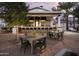 Community outdoor bar area with seating and tables for relaxing outside at 11300 N Casa Dega Dr # 1090, Surprise, AZ 85388