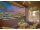 Private balcony features peaceful desert views, cozy seating, and a beautiful sunset at 11500 E Cochise Dr # 2088, Scottsdale, AZ 85259