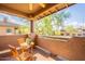 View from the balcony of lush green trees and neighboring buildings on a sunny day at 11500 E Cochise Dr # 2088, Scottsdale, AZ 85259