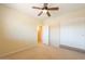 Bedroom featuring neutral walls, carpet flooring and a large closet with doors at 11500 E Cochise Dr # 2088, Scottsdale, AZ 85259