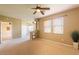 Bedroom featuring neutral carpet, large windows, and a unique central architectural column at 11500 E Cochise Dr # 2088, Scottsdale, AZ 85259