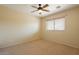 Bedroom boasting neutral walls, carpet flooring and a ceiling fan with light fixture at 11500 E Cochise Dr # 2088, Scottsdale, AZ 85259