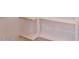 A close up of the white shelving units in the walk-in closet at 11500 E Cochise Dr # 2088, Scottsdale, AZ 85259