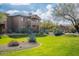 Beautiful home exterior with manicured lawn and desert-friendly landscaping at 11500 E Cochise Dr # 2088, Scottsdale, AZ 85259